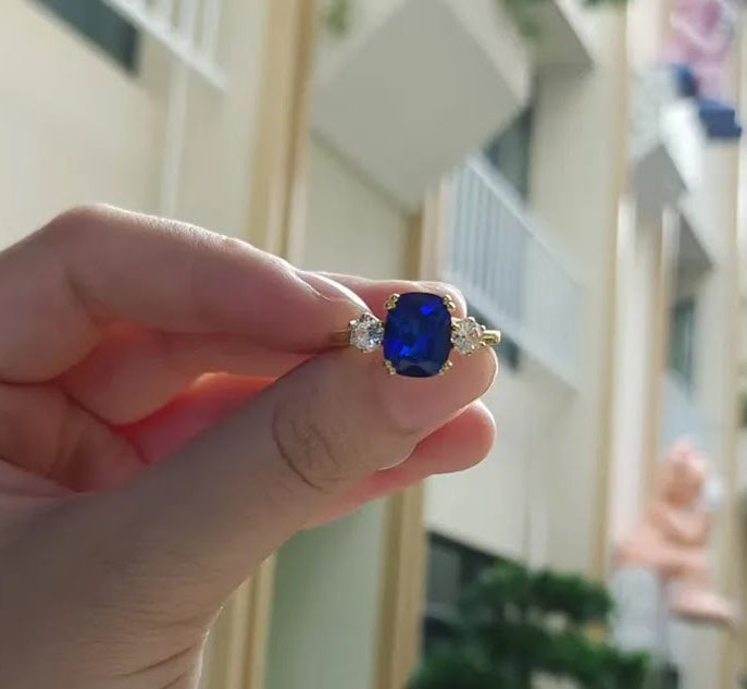 4ct Cushion-Cut Blue Sapphire Three-Stone Engagement Ring