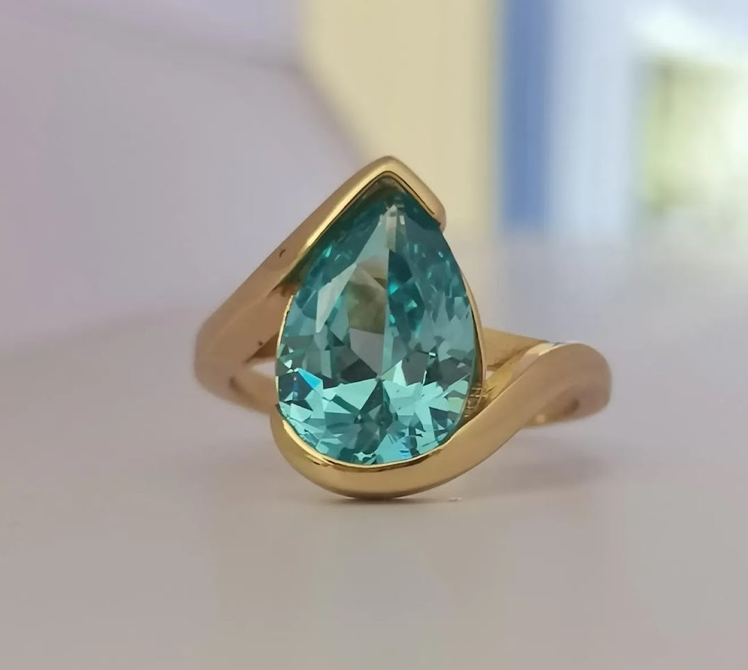 Captivating 5ct Pear Cut Aquamarine Ring with Flowing Bypass Setting