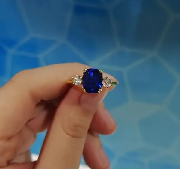 4ct Cushion-Cut Blue Sapphire Three-Stone Engagement Ring