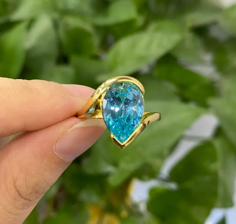 Captivating 5ct Pear Cut Aquamarine Ring with Flowing Bypass Setting