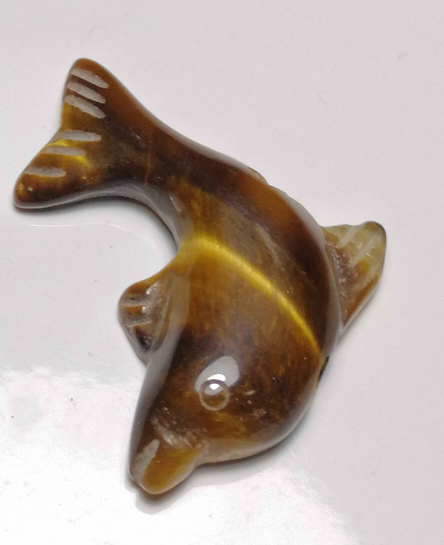 NATURAL CARVED TIGER EYE (dolphin)