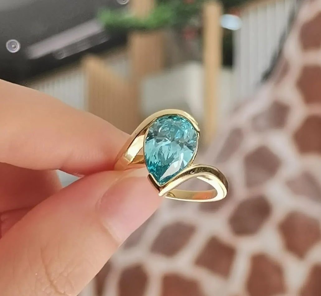 Captivating 5ct Pear Cut Aquamarine Ring with Flowing Bypass Setting