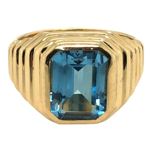 Golden Brilliance: Blue Topaz Statement Ring