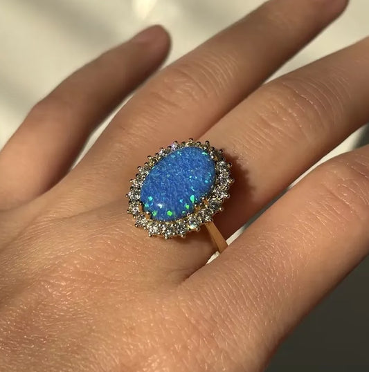 Stunning 7-Carat Oval Black Opal Halo Ring