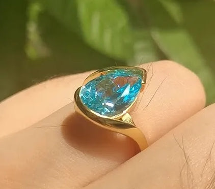 Captivating 5ct Pear Cut Aquamarine Ring with Flowing Bypass Setting