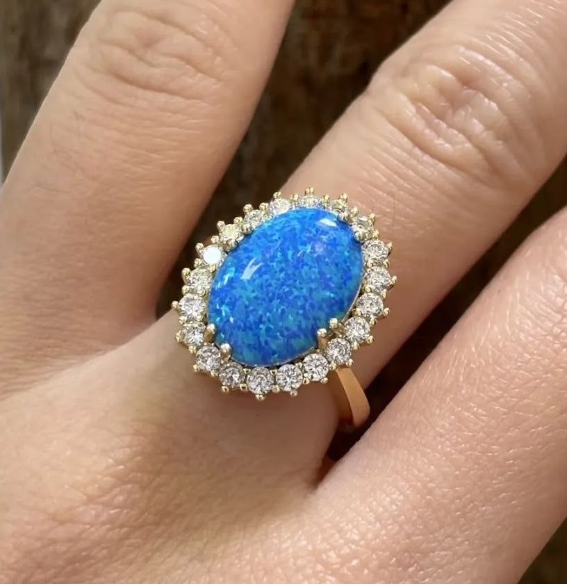 Stunning 7-Carat Oval Black Opal Halo Ring
