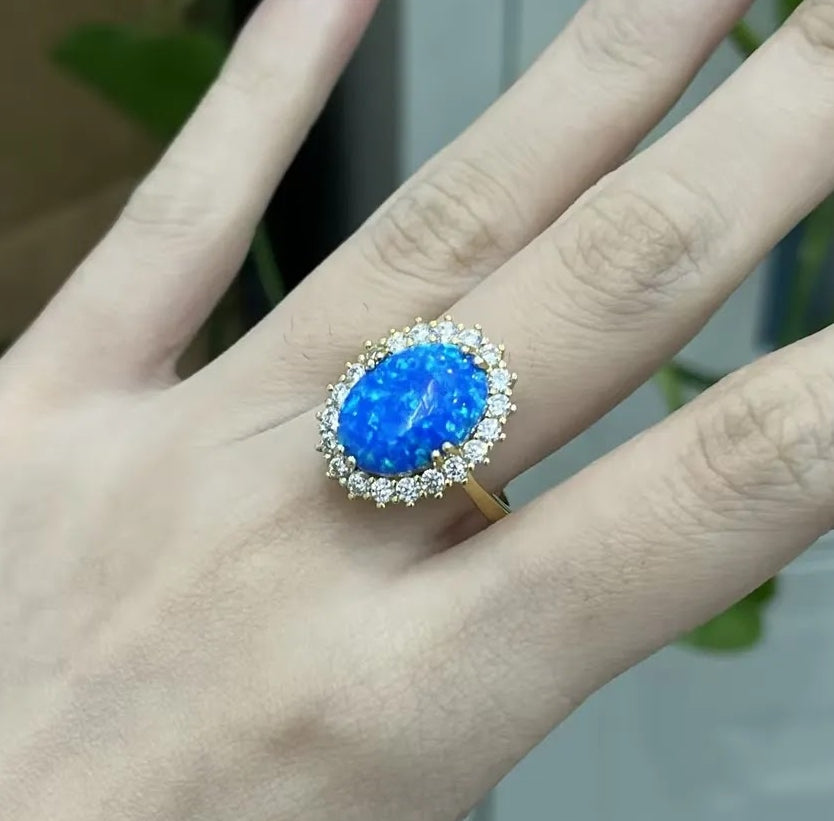 Stunning 7-Carat Oval Black Opal Halo Ring